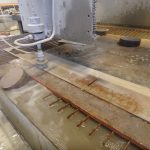 Cutting components on the water jet saw.